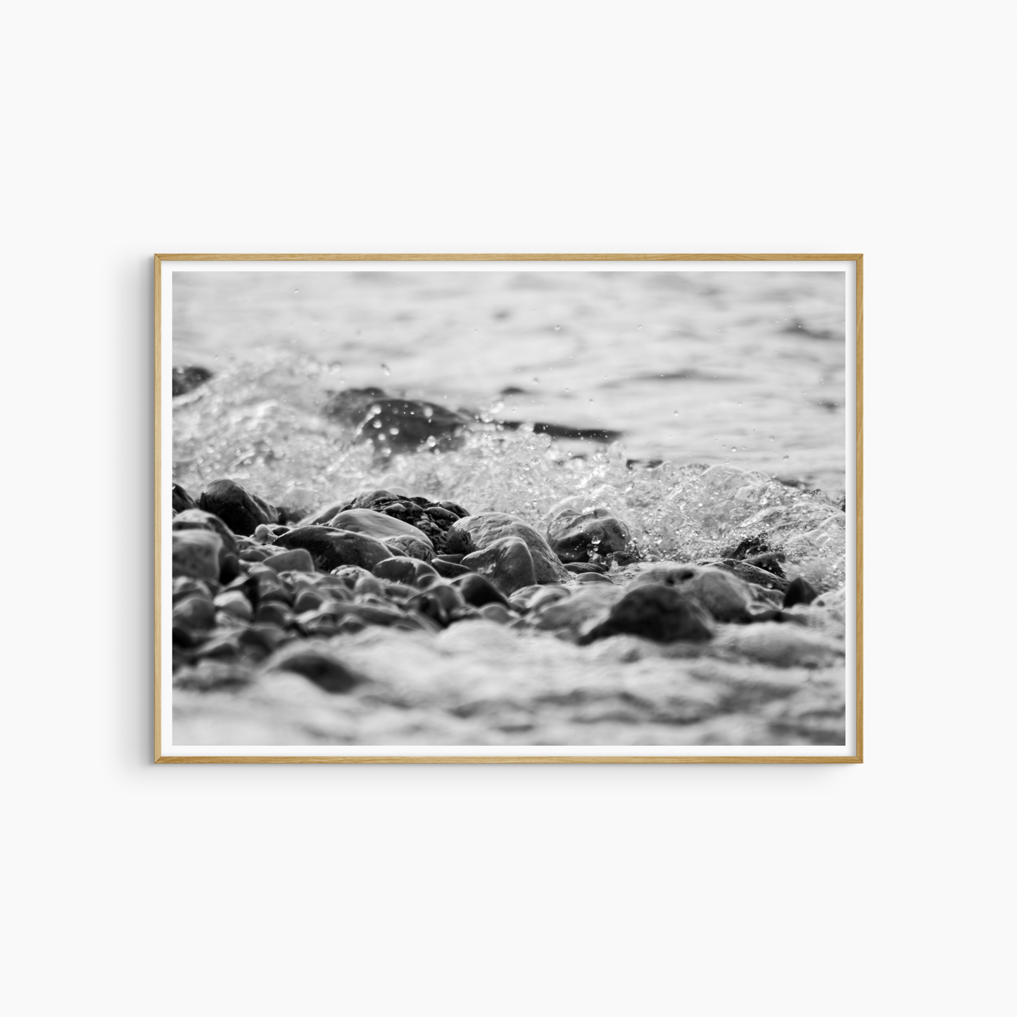 Printable rocky shore photography, black and white pebble beach wall art, wave crashing on rocks print