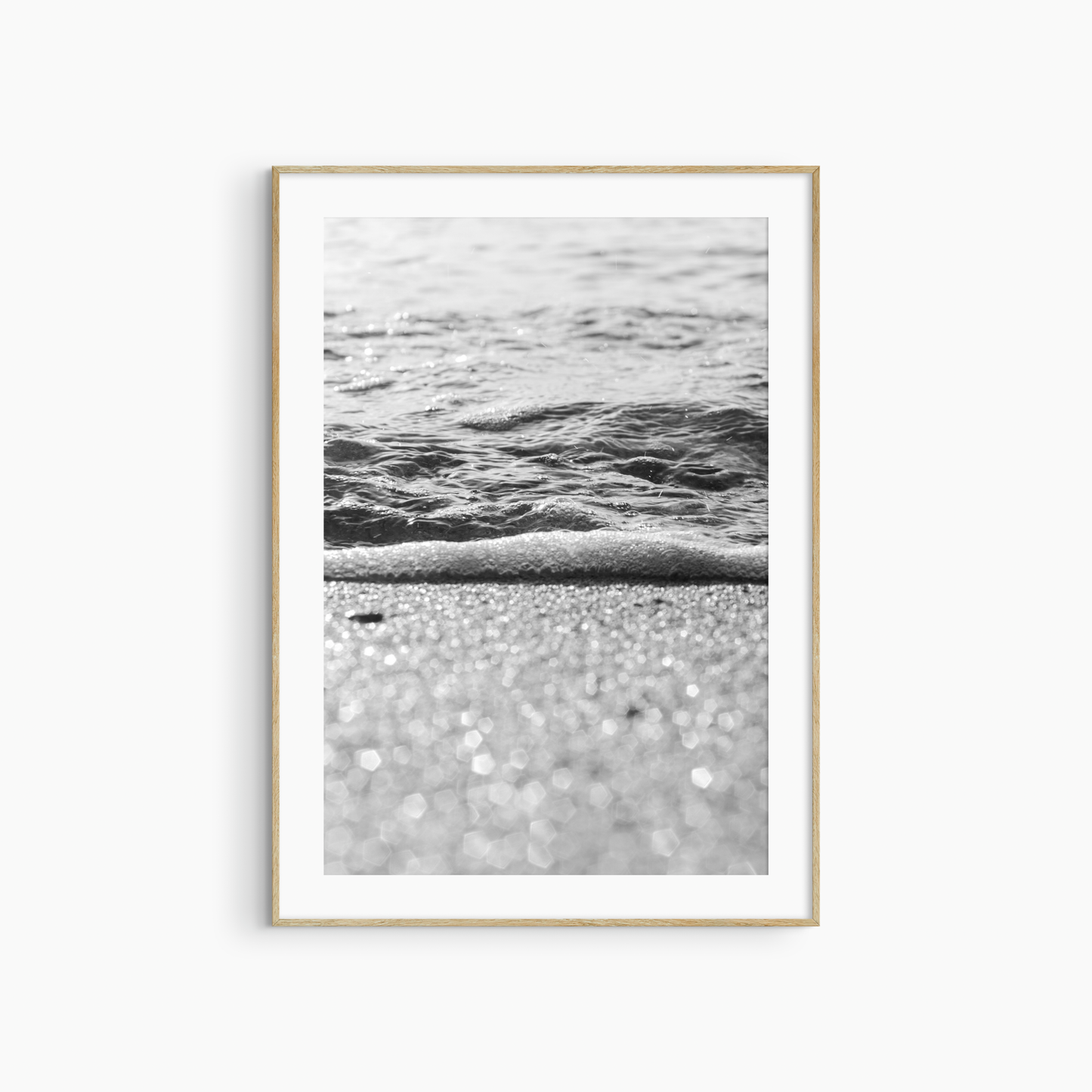 Sparkling sand and sea foam photography print, black and white coastal wall art, beach light print