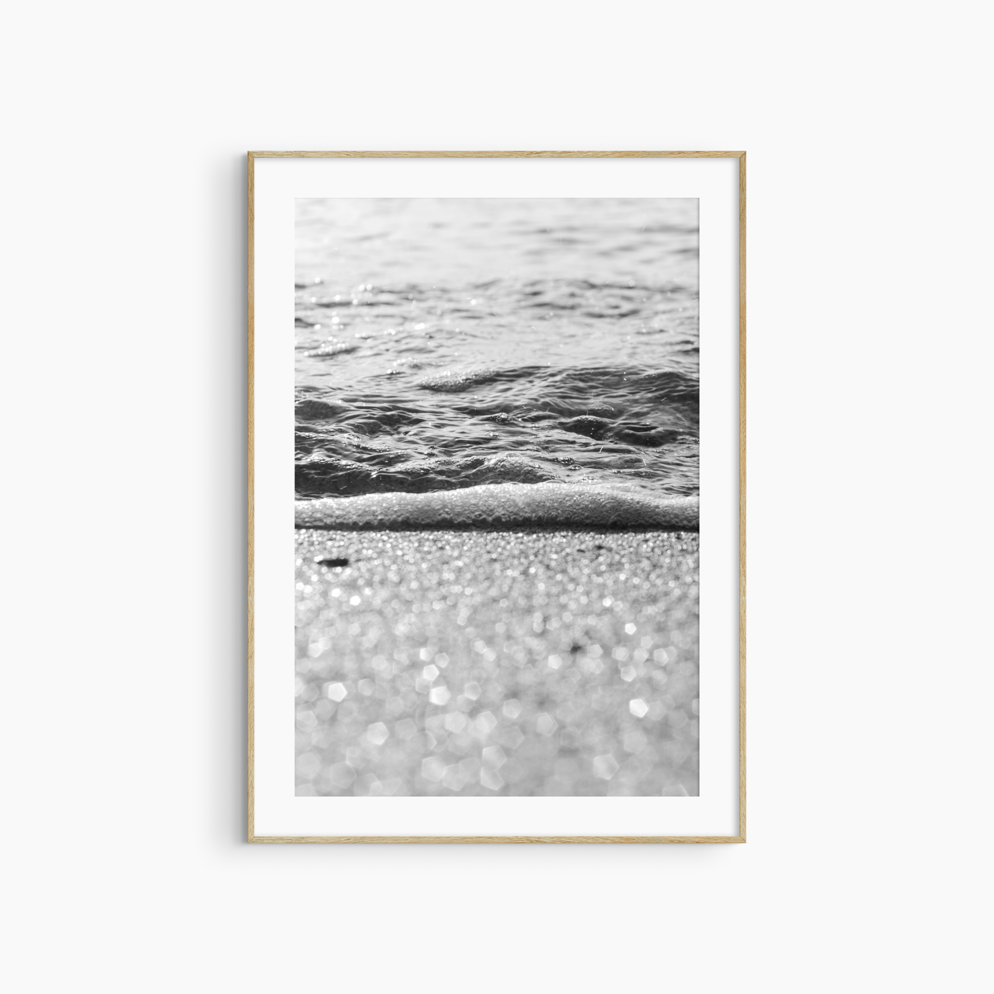 Sparkling sand and sea foam photography print, black and white coastal wall art, beach light print