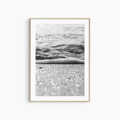 Sparkling sand and sea foam photography print, black and white coastal wall art, beach light print