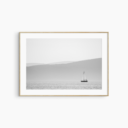 Printable sailboat photography, black and white coastal seascape wall art, lone sailboat print