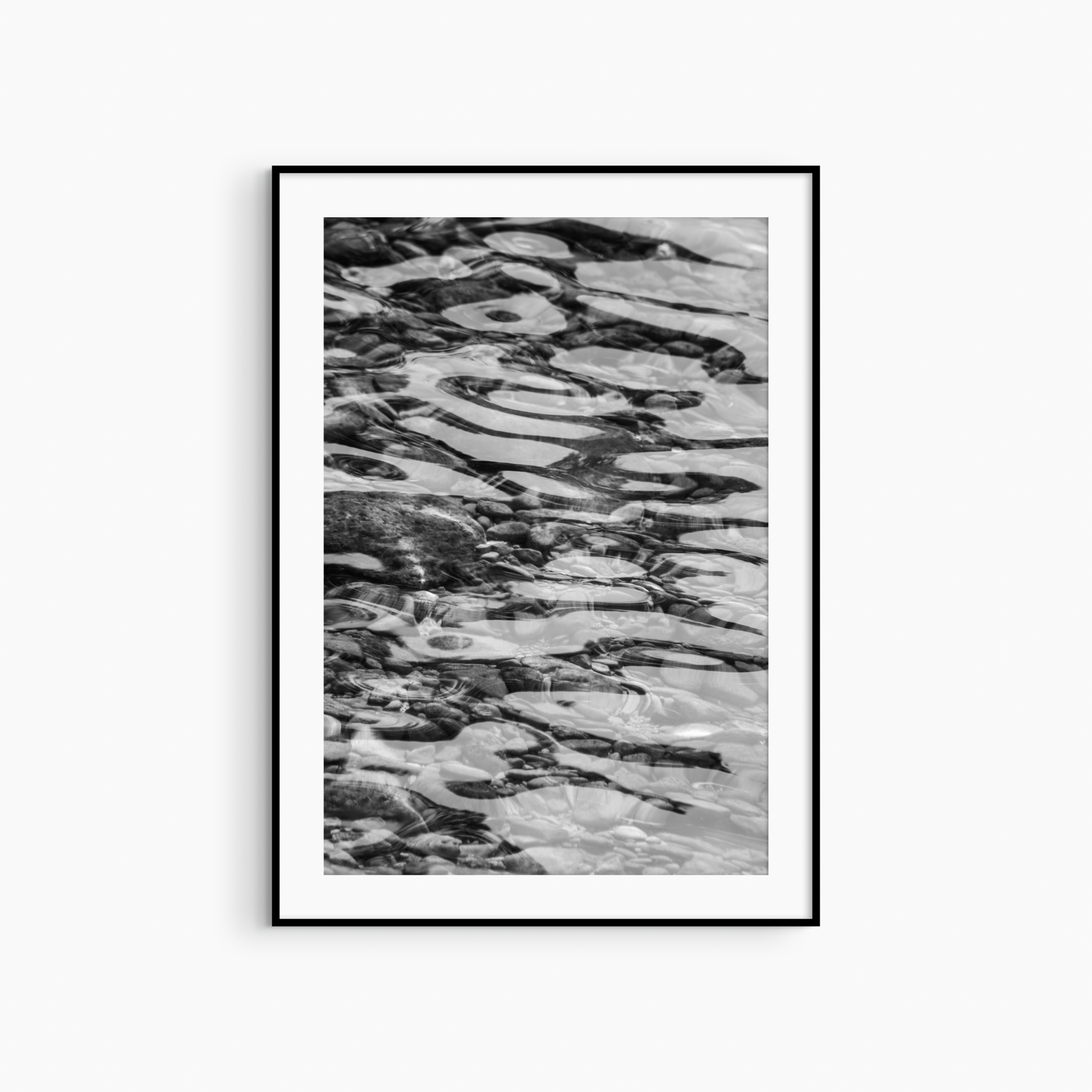 Shallow water over pebbles photography print, black and white abstract coastal wall art, ripple print