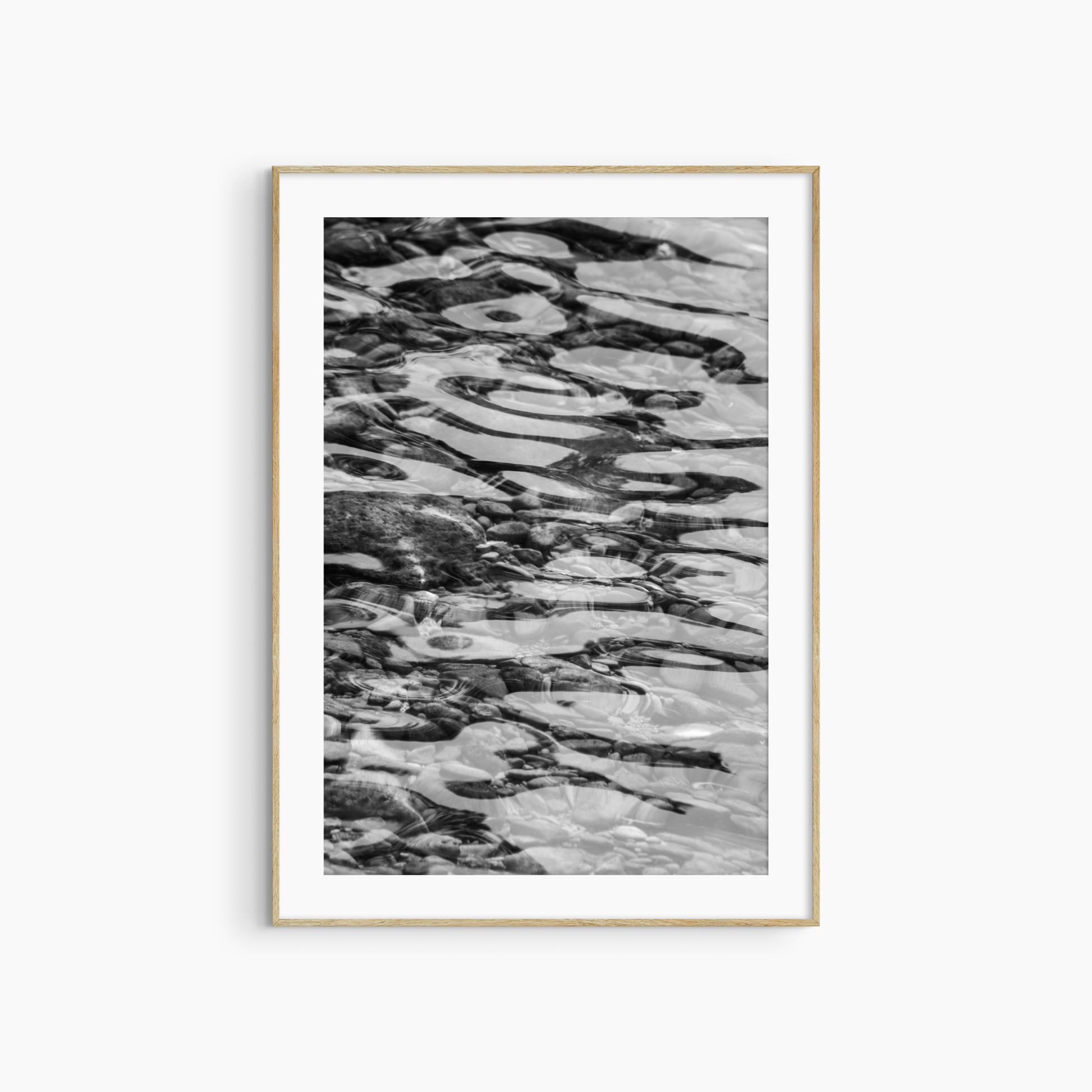 Black and white water and pebbles photography print, abstract coastal wall art, rippling water print