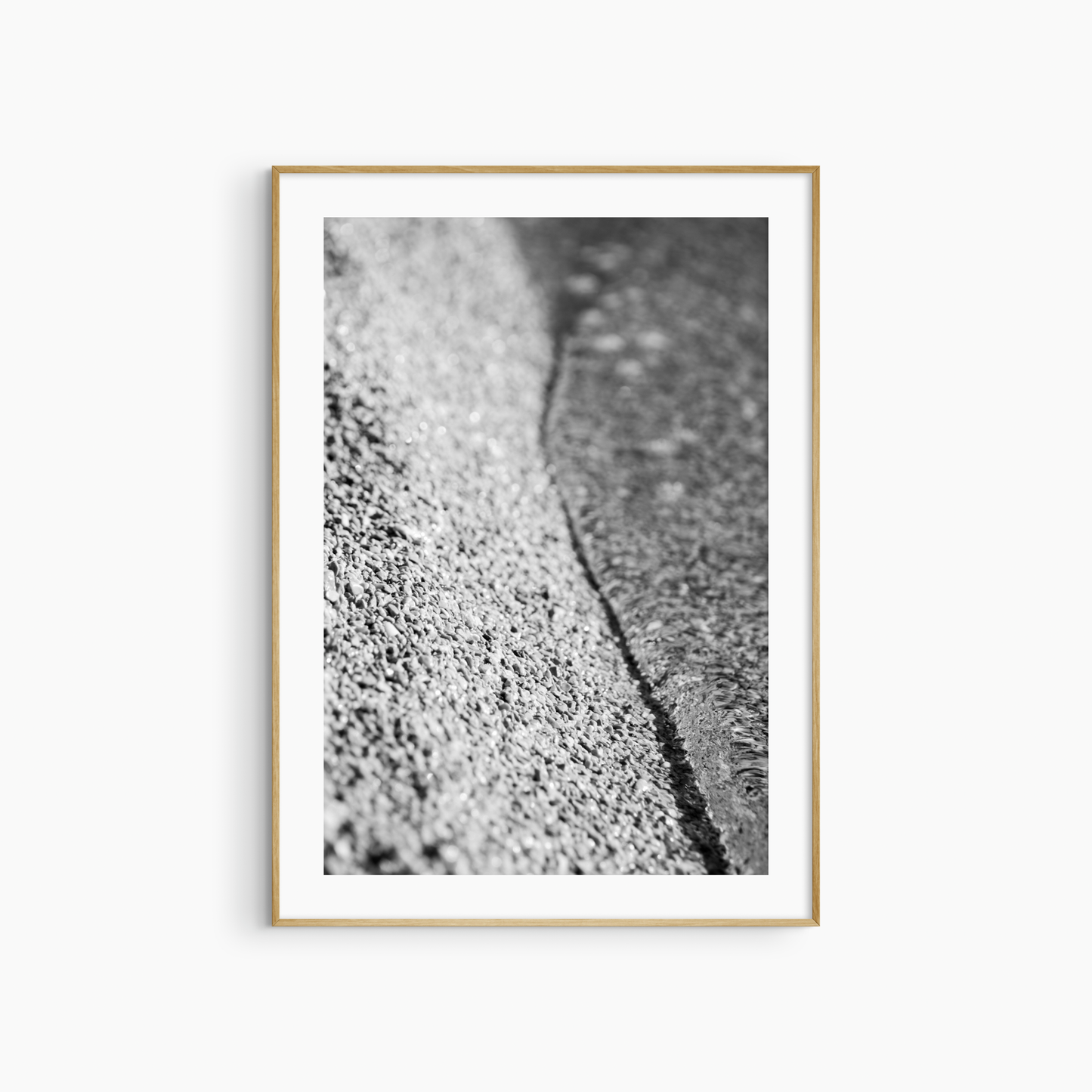Black and white pebble shore photography print, abstract beach texture wall art, coastal gravel print