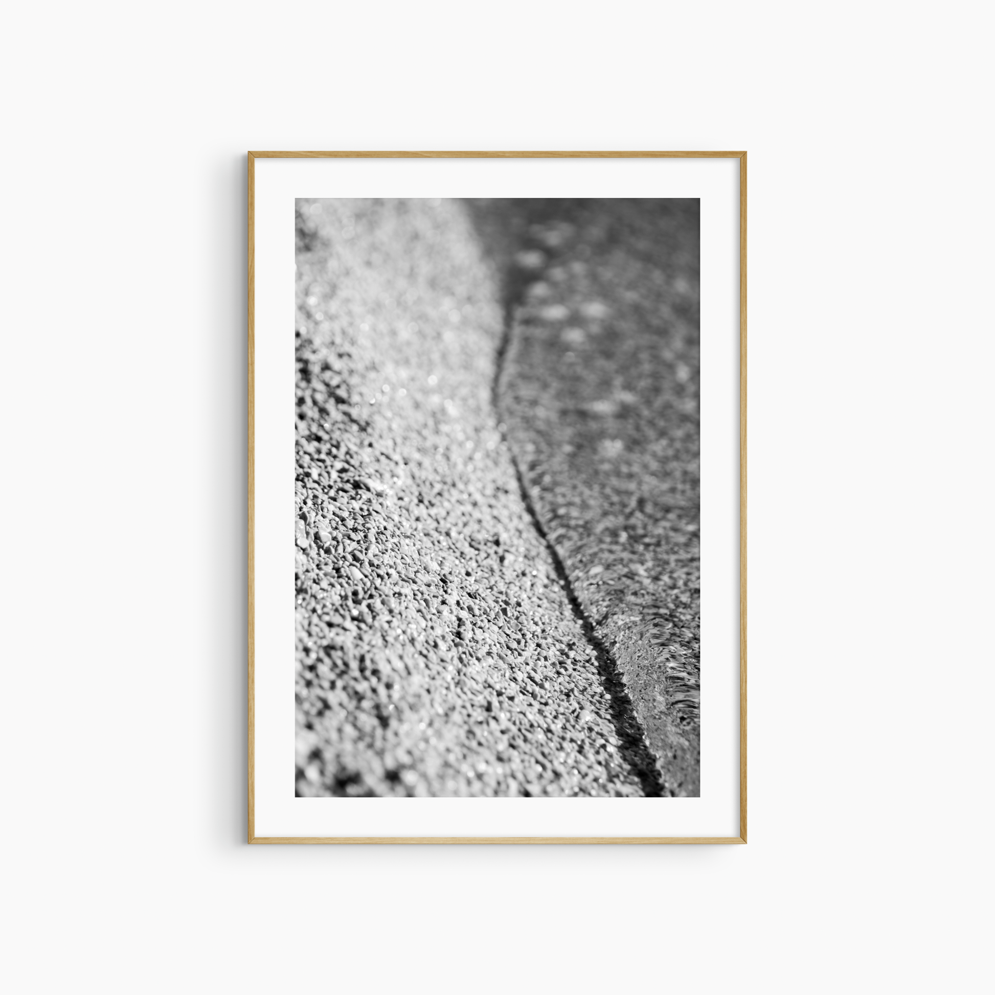 Black and white pebble shore photography print, abstract beach texture wall art, coastal gravel print