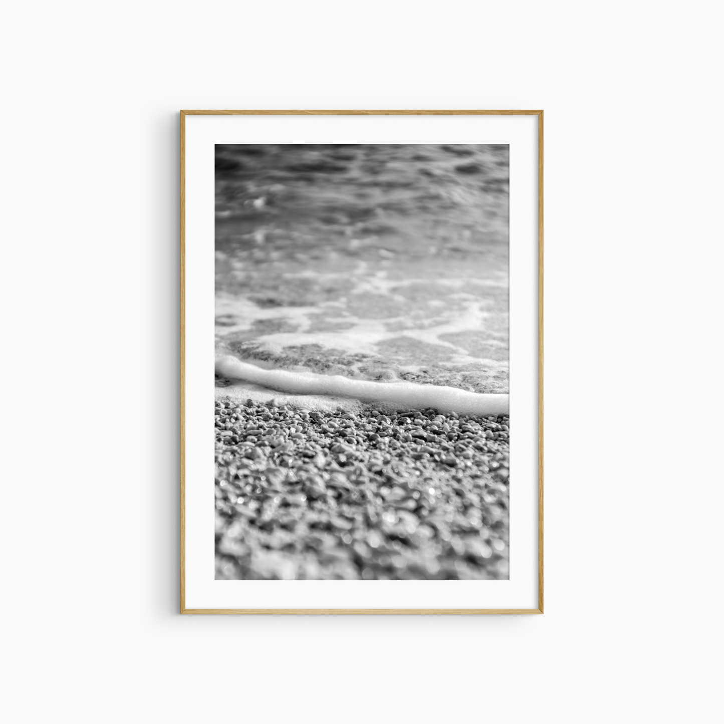 Close-up pebble shore photography print, black and white coastal wall art, foam edge beach print