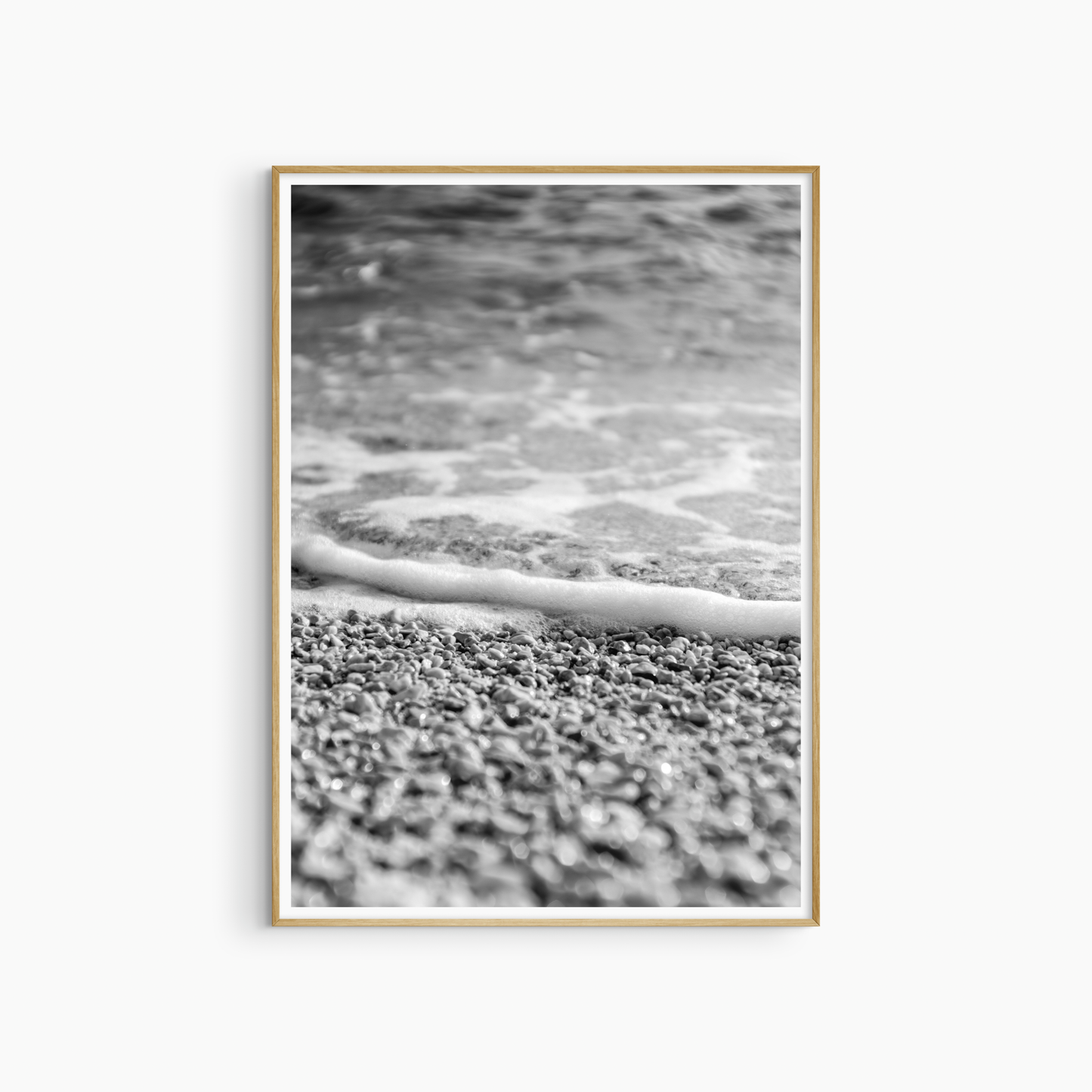 Printable pebble beach photography, black and white shoreline wall art, sea foam and stones print