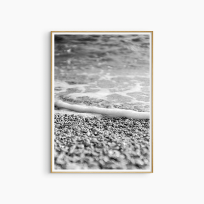 Printable pebble beach photography, black and white shoreline wall art, sea foam and stones print