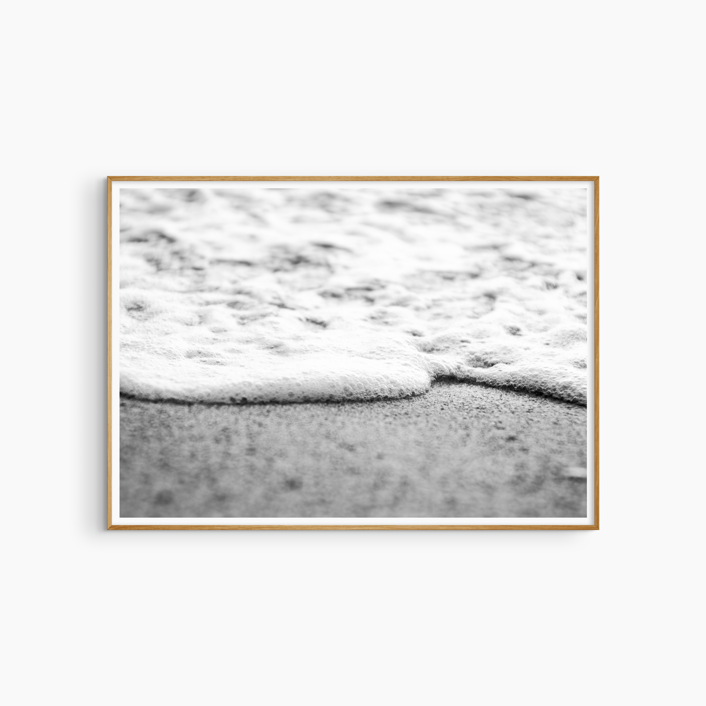 Close-up foam edge and sand photography print, black and white coastal wall art, minimal shore print