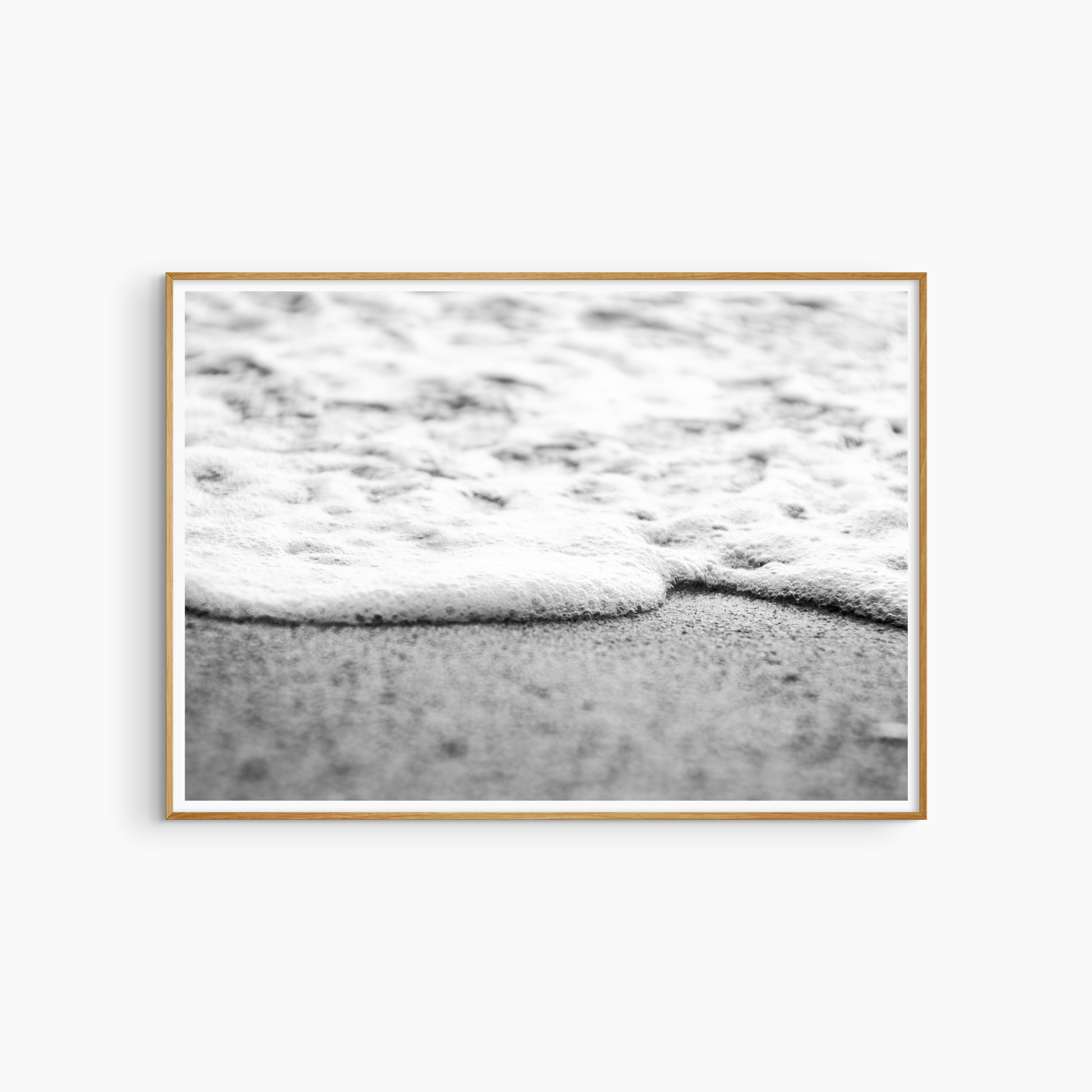 Close-up foam edge and sand photography print, black and white coastal wall art, minimal shore print