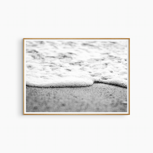 Close-up foam edge and sand photography print, black and white coastal wall art, minimal shore print