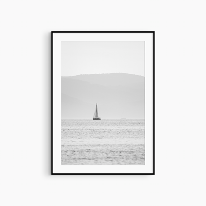 Black and white sailboat photography print, minimalist seascape wall art, lone sailboat and mist print